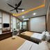 Anjung Pantai Seberang in Kuala Terengganu, twin bedroom with ceiling fan and TV