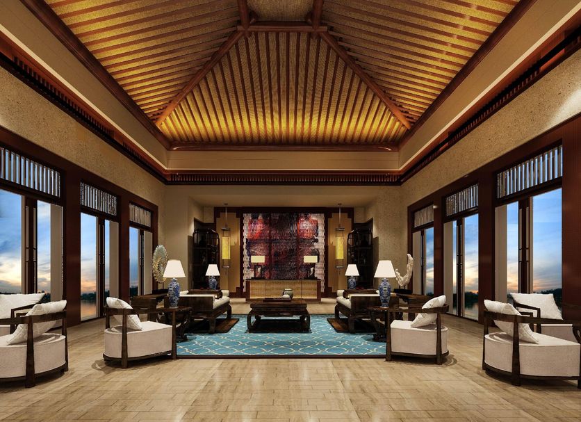 New Century Hotel Guian Guizhou in Anshun lobby with high ceiling, large windows and seating area
