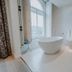 Boutique Hotels Manna & Blue, Nijmegen: modern bathroom with freestanding tub and window view