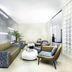 Novotel Ambassador Suwon lounge seating area with modern chairs, sofa and low tables