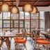 Lakeside Resort Jingdezhen dining room with large windows and hanging lantern-style lights