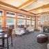 Worldmark Deer Harbor lobby lounge with stone fireplace, large windows and lakefront-style seating