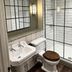 The Punch Bowl, Woodstock hotel bathroom with double sink, toilet, and glass walk-in shower