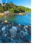 Hotel Arco Do Sol in Balneário Camboriú near a rocky shoreline with a ferris wheel and blue water