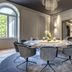 Europäischer Hof Baden-Baden dining room with a round table, gray chairs and chandelier