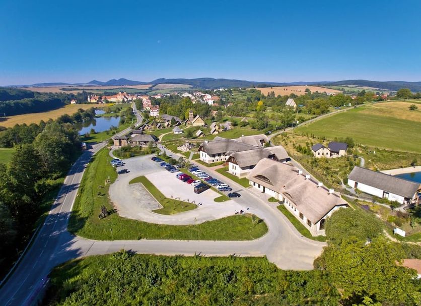 Hotel Mlynska in Uherské Hradiště with aerial view of countryside, river, and hotel grounds