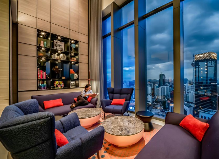 Capri by Fraser, Bukit Bintang lounge with city skyline views in Kuala Lumpur