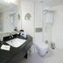 Adana Garden Business Hotel bathroom with vanity, toilet, shower and bathtub in Adana