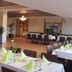 Hotel Asgard in Gersthofen dining room with set tables and a bar area