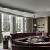 Rosewood Guangzhou in Guangzhou lounge with curved velvet seating, coffee table, and large windows