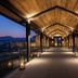 Hotel Yellowstone at Jackson Hole covered walkway with glass railings and mountain sunset views in Jackson