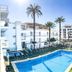 Eix Alcudia Hotel +18 in Alcúdia with outdoor pool, sun loungers and palm trees