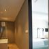 Zandpaviljoen Pier 7 in Vlissingen with kitchenette hallway leading to a bright bedroom