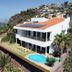 Vivenda Belo Horizonte in Caniço with ocean view, hillside setting, pool, and sun loungers
