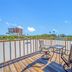 Carousel Suites -Redington Shores rooftop deck with chairs and table overlooking the water