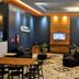 Minas Garden Hotel in Poços de Caldas lobby lounge with seating, TV and modern lighting