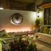 Hotel Lindo Ajijic Bed & Breakfast patio lounge in Ajijic with cushioned seating and warm wall lighting
