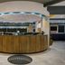 Tru by Hilton Austin Airport lobby with circular front desk and modern lighting in Austin