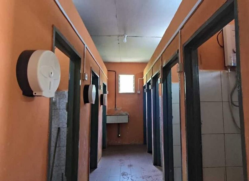 Kinabalu Poring Vacation Lodge, Kundasang: corridor with restroom doors and wall-mounted dispensers