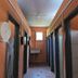 Kinabalu Poring Vacation Lodge, Kundasang: corridor with restroom doors and wall-mounted dispensers