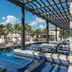 Royalton CHIC Punta Cana adults-only resort poolside cabanas, palm trees and loungers in Punta Cana