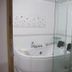 Time Motel in Gyeongju bathroom with corner bathtub and glass shower enclosure