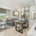 Embassy Suites by Hilton Raleigh Durham Airport Brier Creek suite with kitchenette, desk and sofa in Raleigh