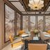 BLESS Hotel Madrid meeting room with round table, orange chairs and large scenic wall panels