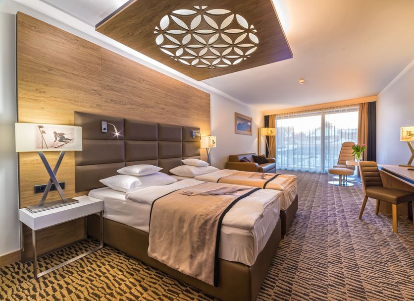 Rezydencja Nosalowy Dwór in Zakopane: modern hotel room with twin beds, desk, and balcony view