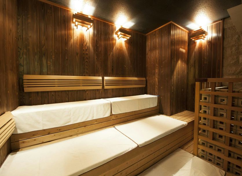Dormy Inn Premium Hakata Canal City Mae Natural Hot Spring sauna lounge in Fukuoka with wooden benches