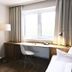 Hotel Sturm Bio- & Wellnesshotel in der Rhön room with desk, chair, bed and window in Mellrichstadt