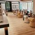 Hanok Hotel Daam in Seoul lounge with round chairs, wooden tables, and large windows