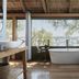 Victoria Falls River Lodge bath with river views and freestanding tub in open-air suite, Victoria Falls