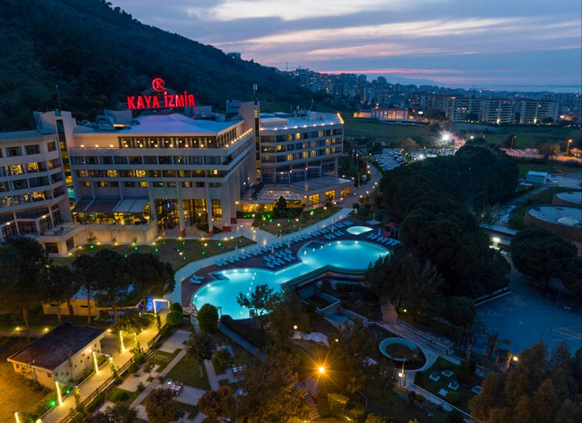 Kaya Izmir Thermal & Convention in Izmir with illuminated outdoor pools at dusk and city views