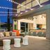 Homewood Suites by Hilton Aliso Viejo - Laguna Beach patio with string lights and outdoor seating