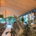 Van der Valk hotel Harderwijk outdoor event tent with round tables, chairs and string lights