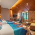 Expo Garden Resort Hotel Jinan room with two beds, teepee tent, sofa and balcony view