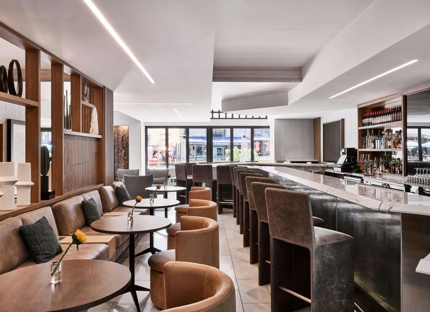 AC Hotels by Marriott San Diego Downtown Gaslamp Quarter lounge with bar seating and city views