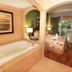 Mizner Place at Weston Town Center in Weston, suite with jetted tub and bedroom near balcony door