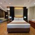 Golden Peak Hotel & Suites powered by Cocotel in Cebu City guest room with king bed and sofa seating