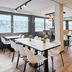 B&b Hotel Wiesbaden-Ost in Wiesbaden breakfast room with white tables, chairs and wood flooring