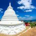 The Beach Camp Yala in Kirinda: white stupa with ocean view under blue sky