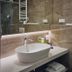Bathroom vanity at Casino & Hotel ADMIRAL Carnevale Škofije in Koper with vessel sink and large mirror