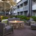Courtyard by Marriott San Mateo Foster City outdoor fire pit seating in a landscaped courtyard