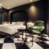 Hotel The Designers Premier Seongsu and Konkuk Univ room in Seoul with black-and-white checkered floor and green chair