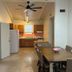 Tropical Resort & Marina on Lake Beresford in DeLand suite with dining table and kitchenette