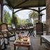 Jardin de Carrejo in Cabezón de la Sal, outdoor terrace with armchairs, tables and garden views