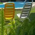 Pousada Aconchego de Genipabu in Natal with colorful loungers by a small pool