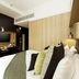 Bedroom at Wilde Aparthotels London Covent Garden in London with king bed and wood-paneled wall
