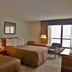 Tawas Bay Beach Resort in East Tawas room with two beds and a lake-view window